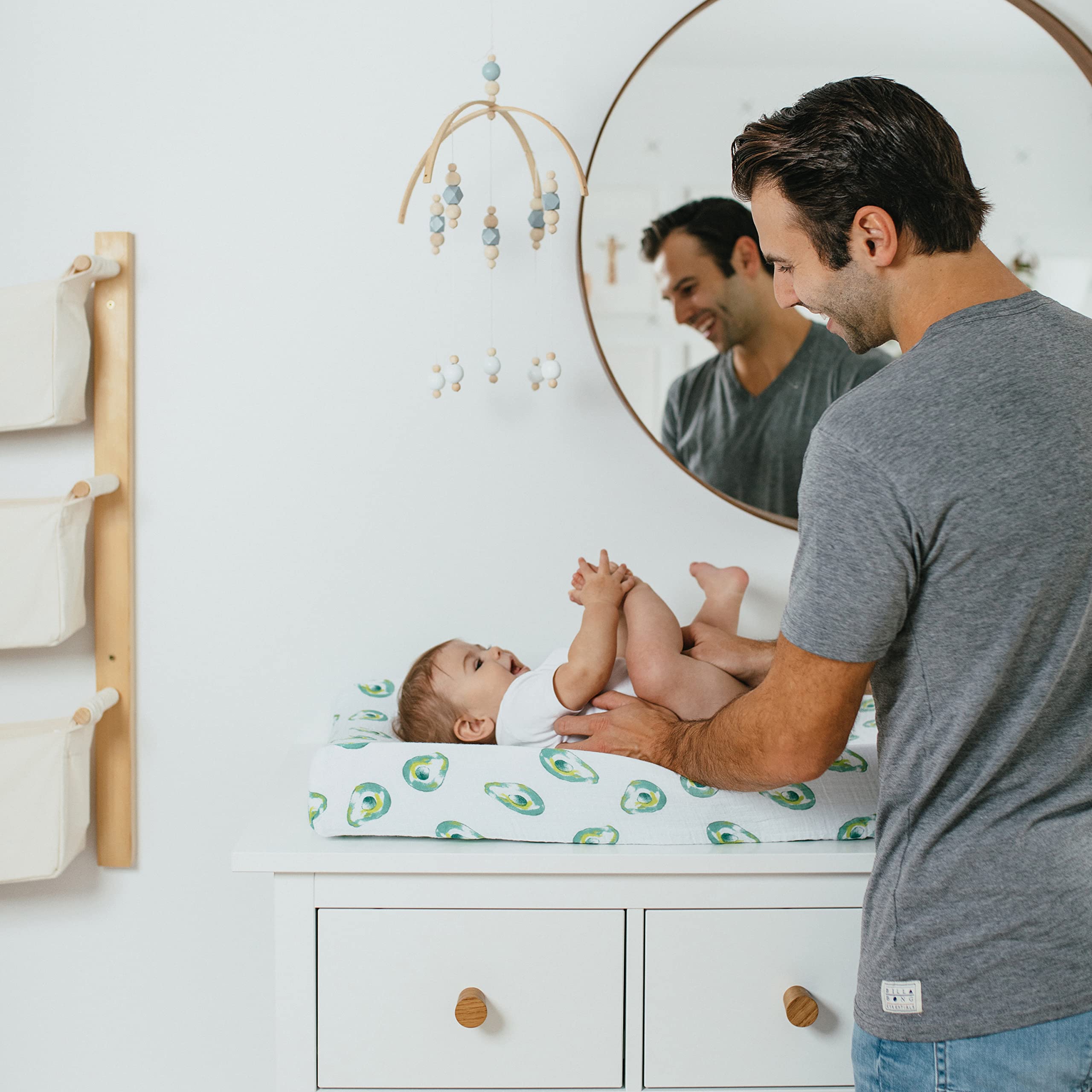 aden + anais essentials changing pad cover avocados on nursery display showing soft fabric and design