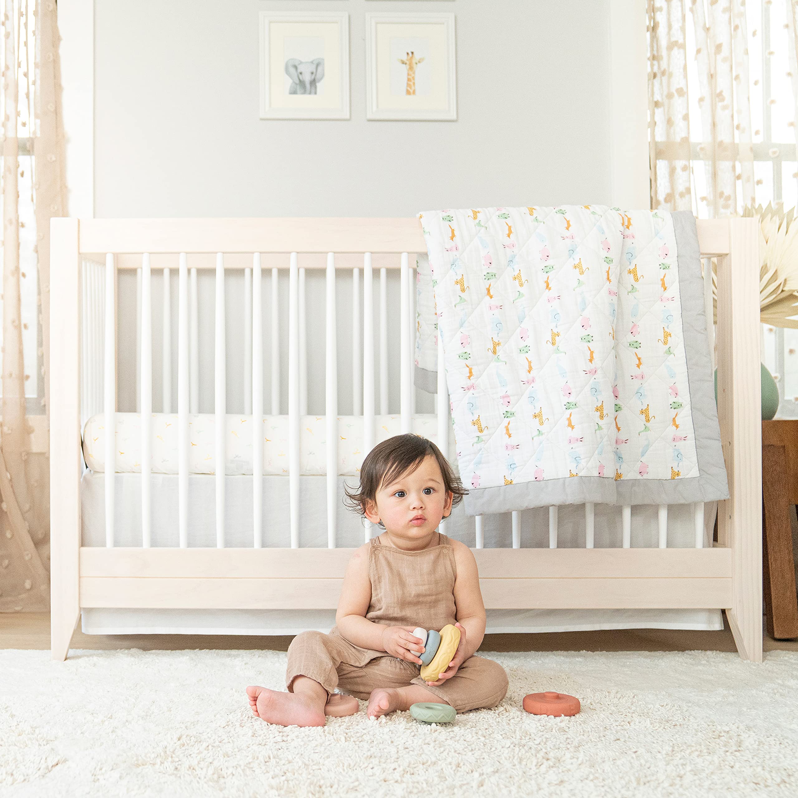 aden + anais essentials changing pad cover coordinates with crib bedding for a cohesive nursery