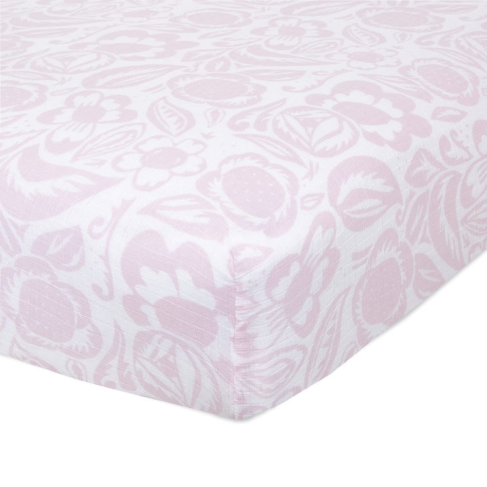 aden + anais Essentials Classic Crib Sheet folded, showing soft muslin and snug fit for baby sleep