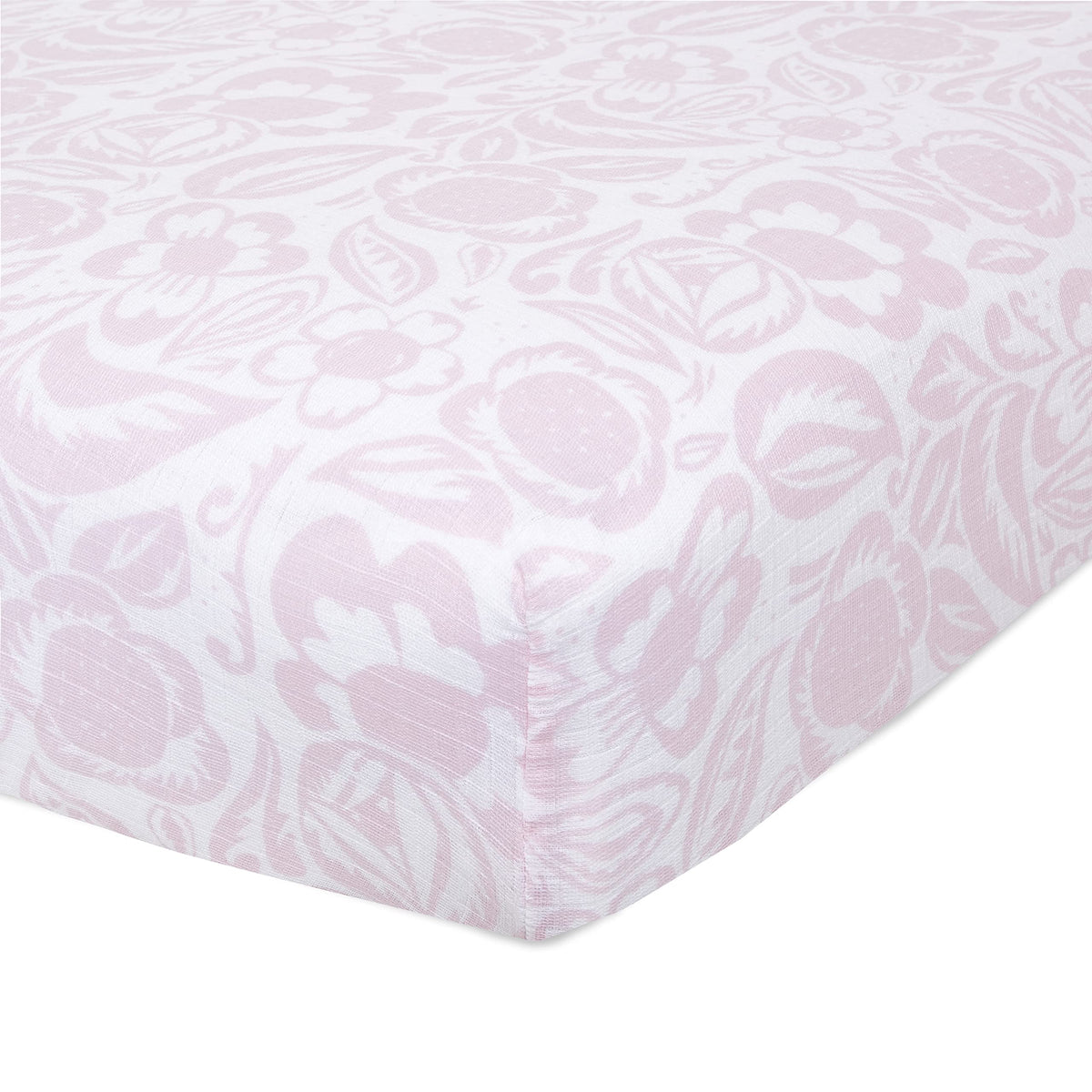 aden + anais Essentials Classic Crib Sheet folded, showing soft muslin and snug fit for baby sleep
