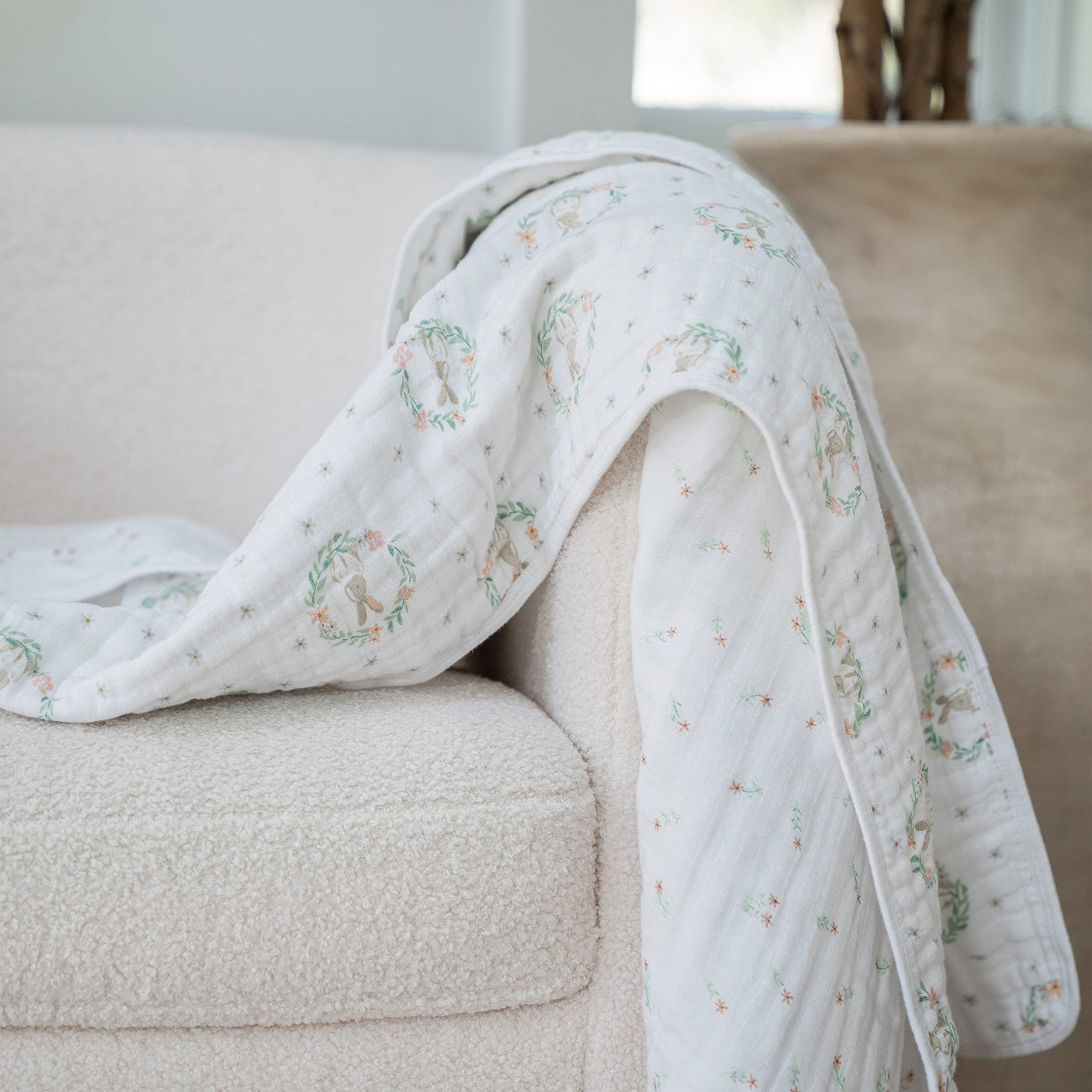 aden + anais Essentials Dream Blanket on the crib for versatile warmth and security.