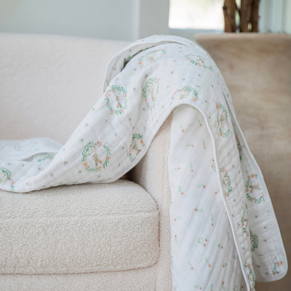 aden + anais Essentials Dream Blanket on the crib for versatile warmth and security.