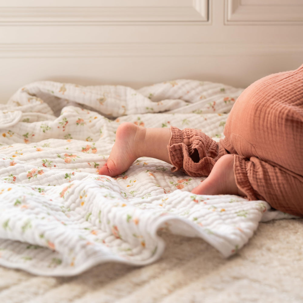 aden + anais Essentials Dream Blanket laid during tummy time for soft support