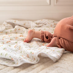 aden + anais Essentials Dream Blanket laid during tummy time for soft support
