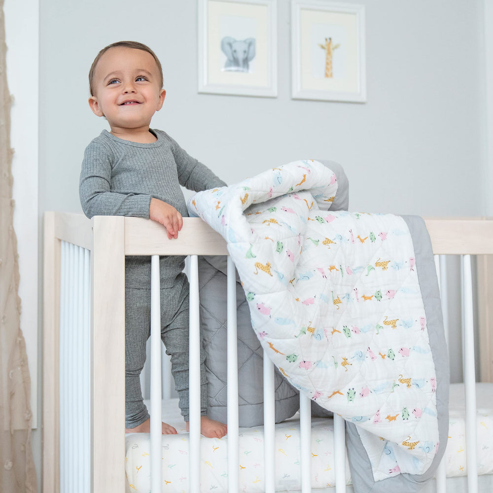 Aden + Anais Essentials exclusive hand-painted prints add modern nursery charm.