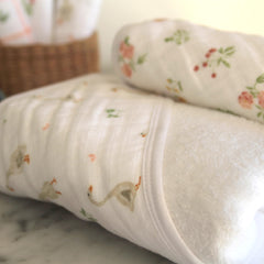aden and anais Essentials hooded towel Country Floral towel folded, absorbent cotton terry wraps snugly