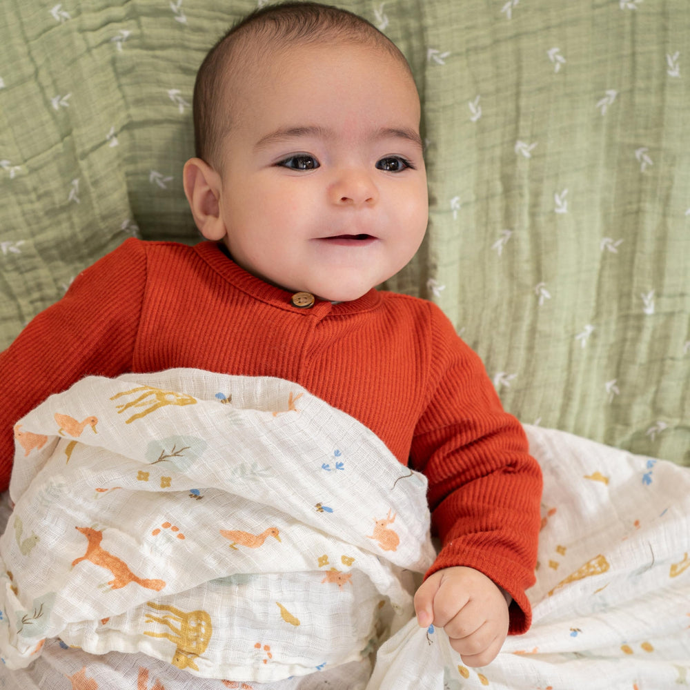 aden + anais essentials muslin swaddle 44x44 close-up emphasizes ultra-soft fabric for everyday use.