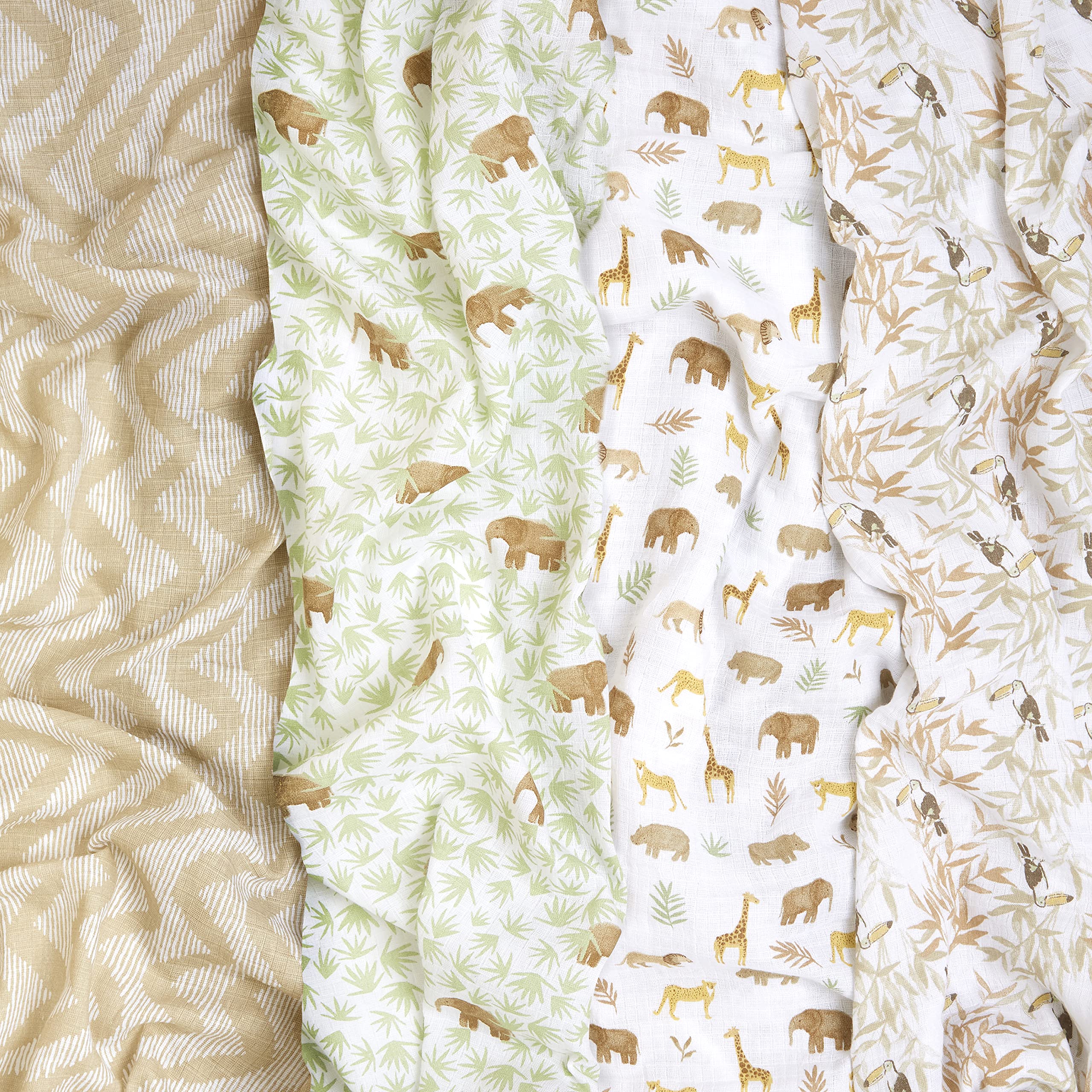 aden + anais Essentials swaddle blankets in use around a baby for snug, breathable comfort.