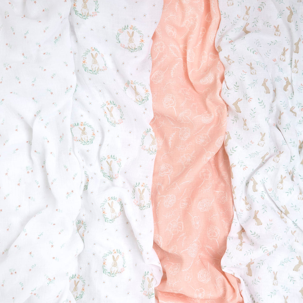 aden + anais muslin swaddle blanket Blushing Bunnies demonstrates oversized 44-inch square versatility for daily use.