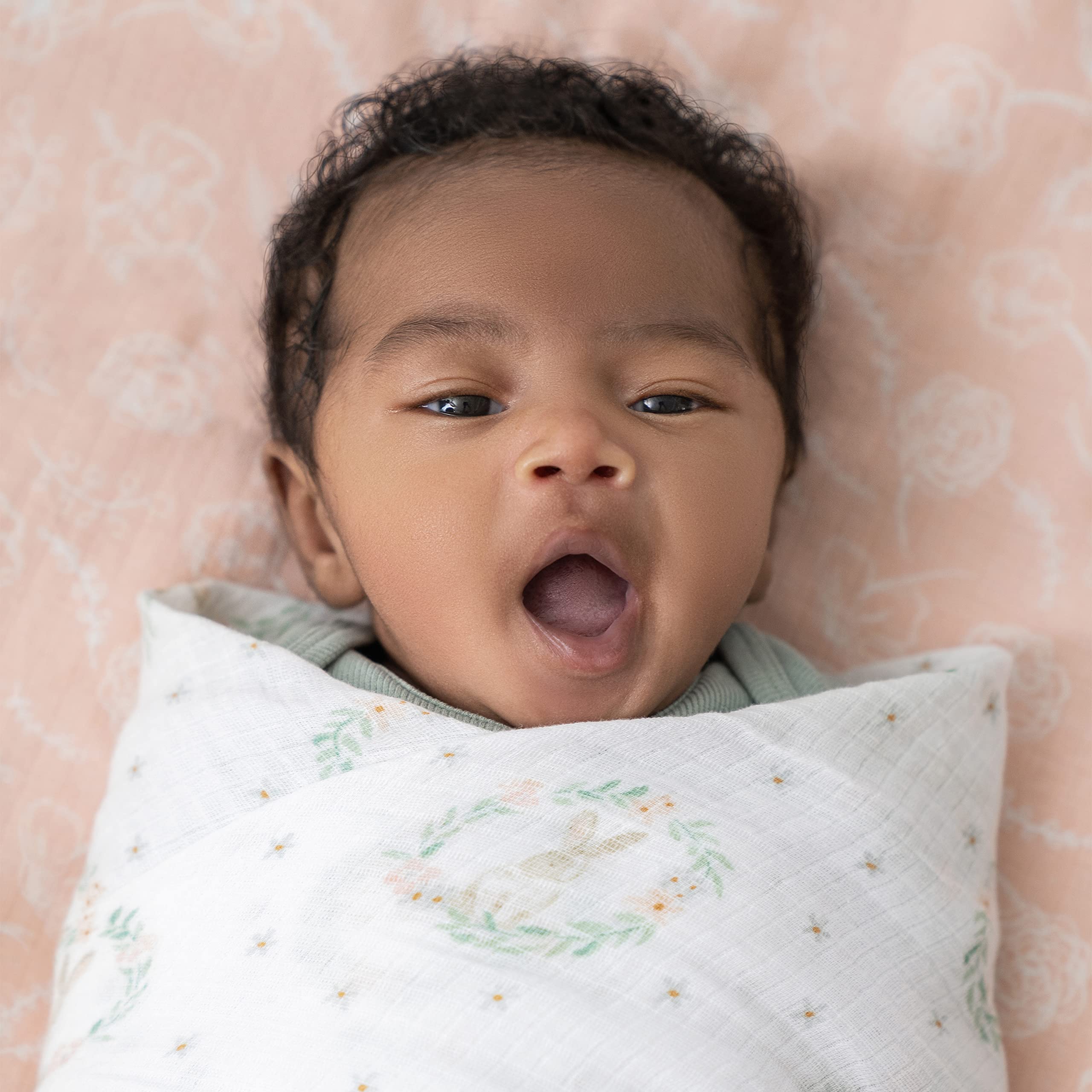 aden + anais blanket is lightweight and absorbent for feeding moments.
