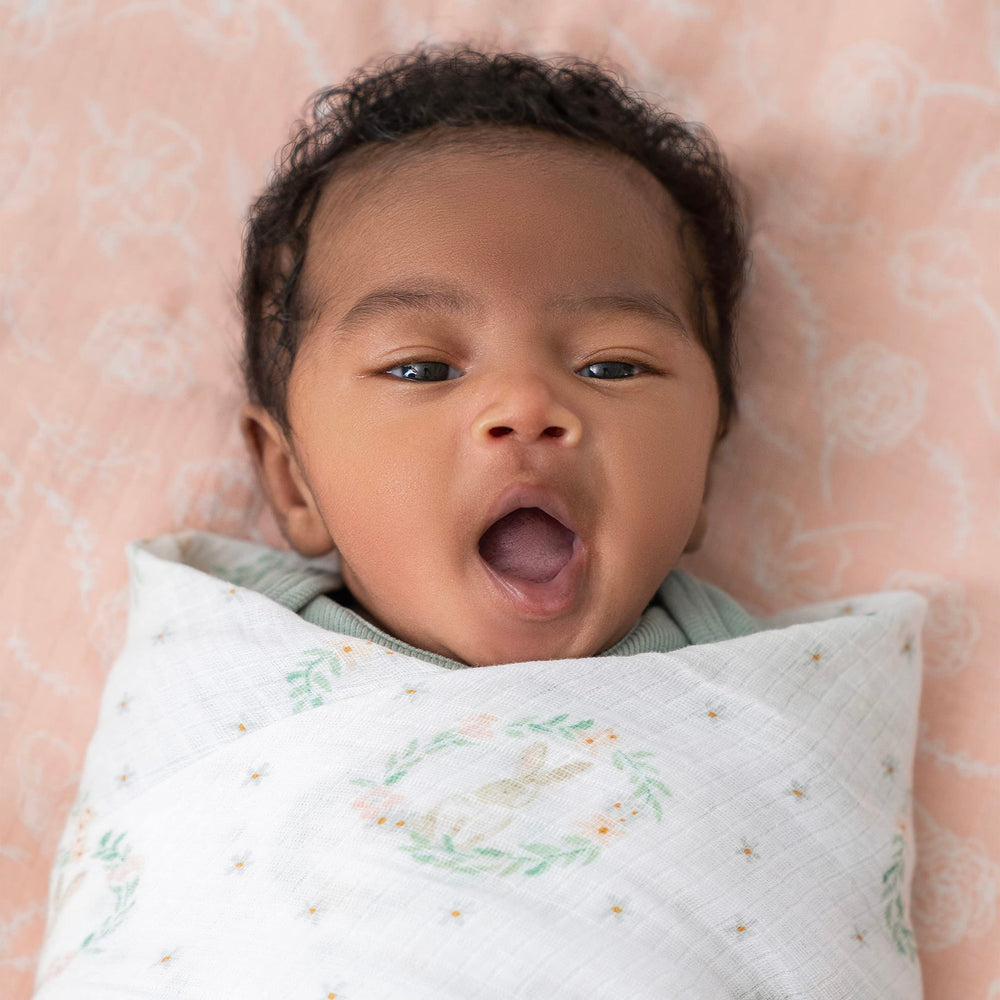 aden + anais blanket is lightweight and absorbent for feeding moments.
