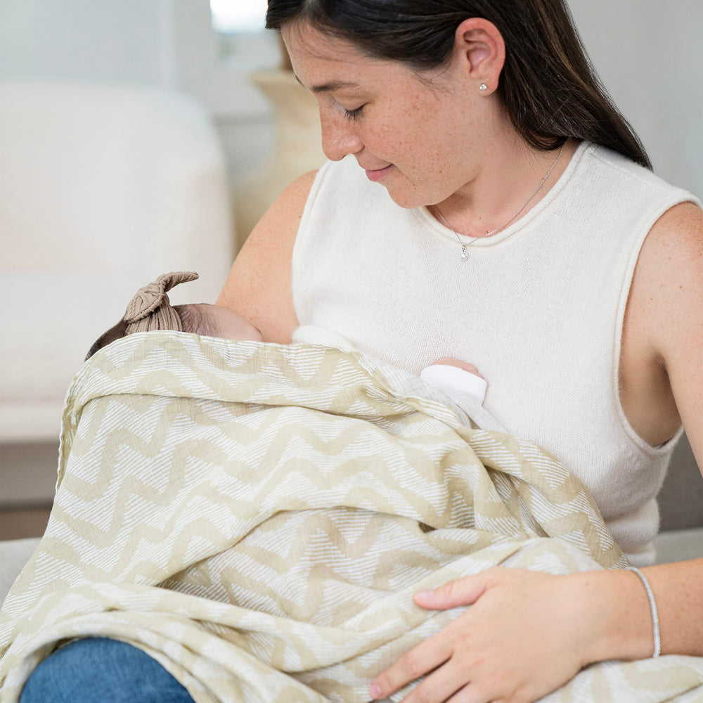 aden + anais swaddle being machine washed highlighting lasting softness and durability.