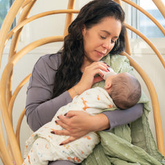 aden + anais Essentials muslin swaddle Sage Woodland used as a light stroller cover and cooling wrap.