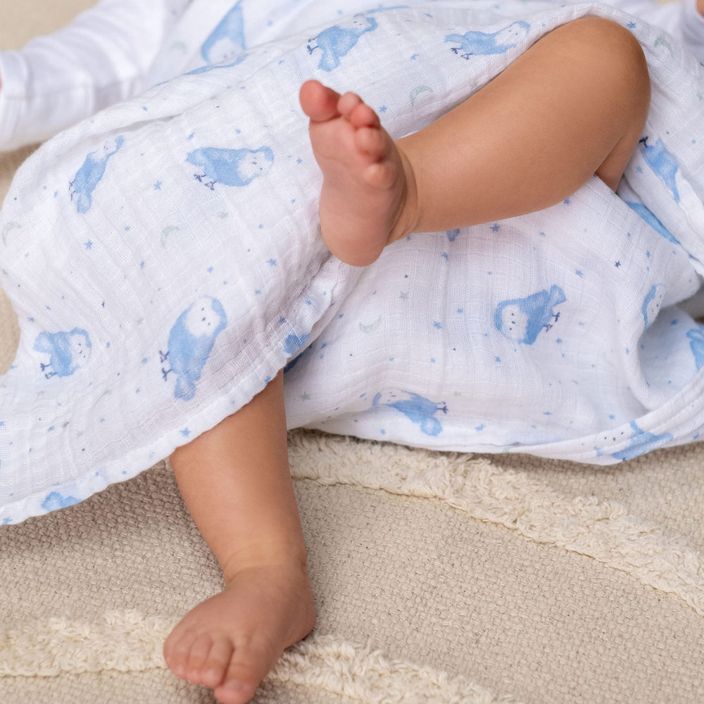 aden + anais Essentials swaddle blanket in stroller use shields sun and adds softness.