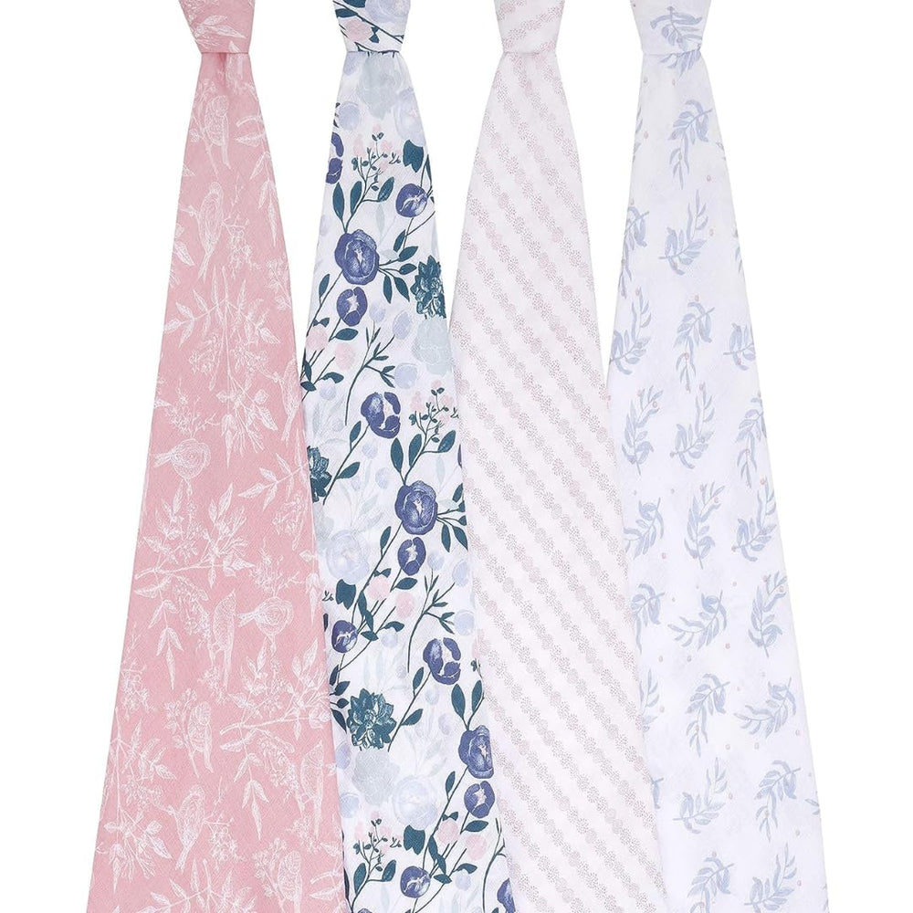 aden + anais Flower's Bloom swaddle wrapped around baby for snug swaddling.