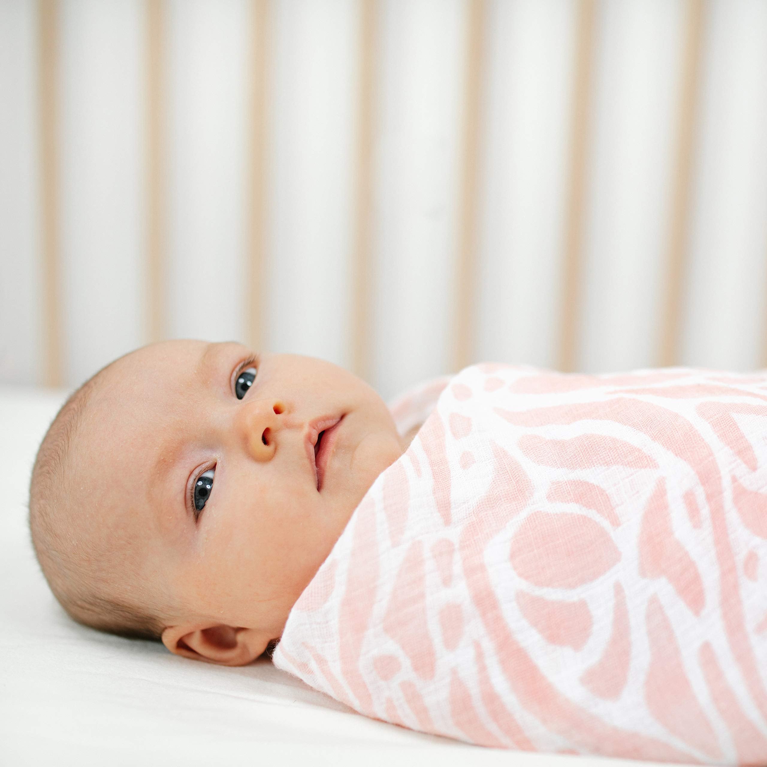 aden + anais Essentials Swaddle Tropicalia blanket as a burp cloth