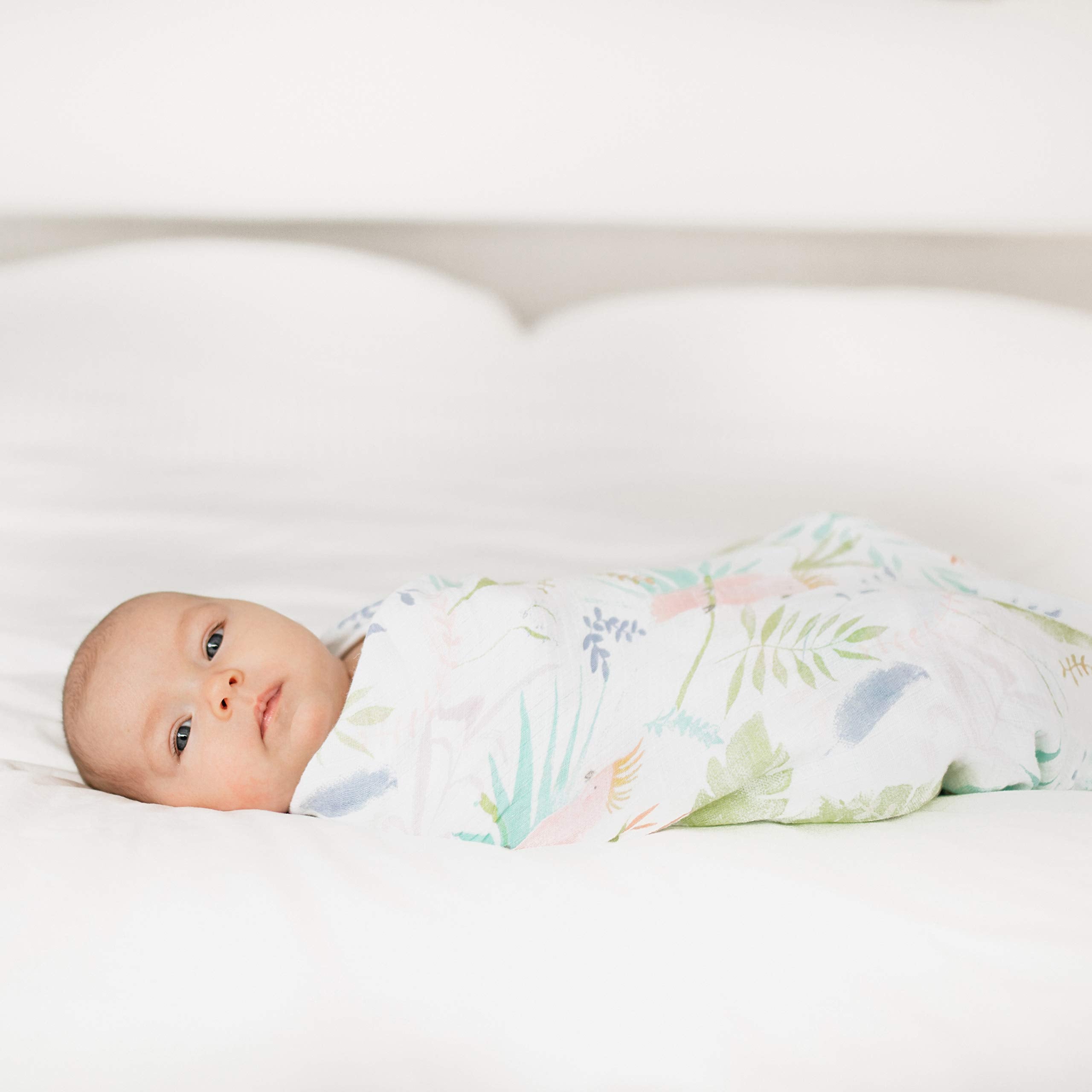 aden + anais Essentials Swaddle Tropicalia blanket serving as a nursing cover