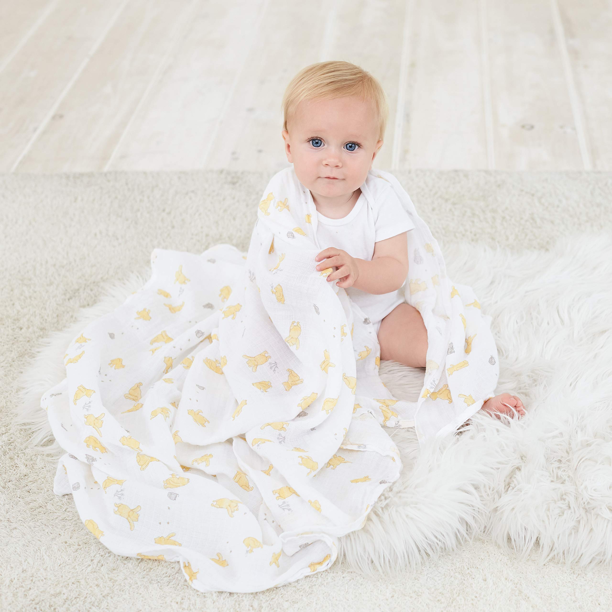 aden + anais Winnie + Friends swaddle blanket as nursing cover for discreet feeding moments