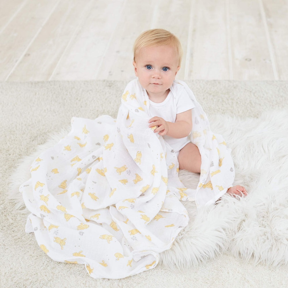 aden + anais Winnie + Friends swaddle blanket as nursing cover for discreet feeding moments