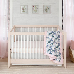 aden + anais Flowers Bloom crib skirt full view demonstrating snug fit for standard cribs