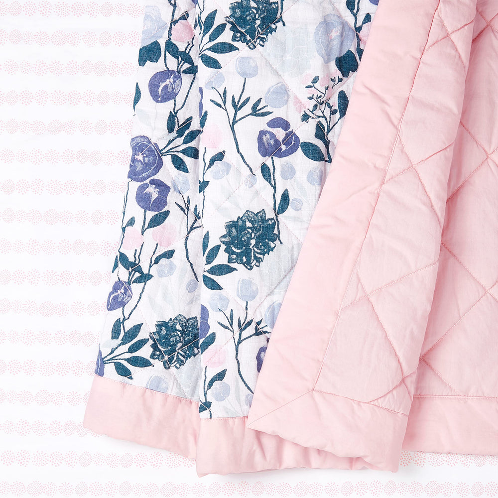 aden + anais Flowers Bloom crib set displayed on a crib for timeless style