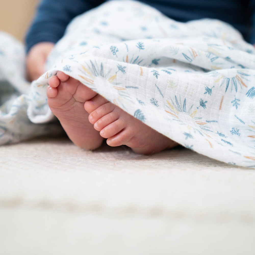 aden +anais Harmony large 44x44 swaddle laid flat, showcasing generous wrap space.
