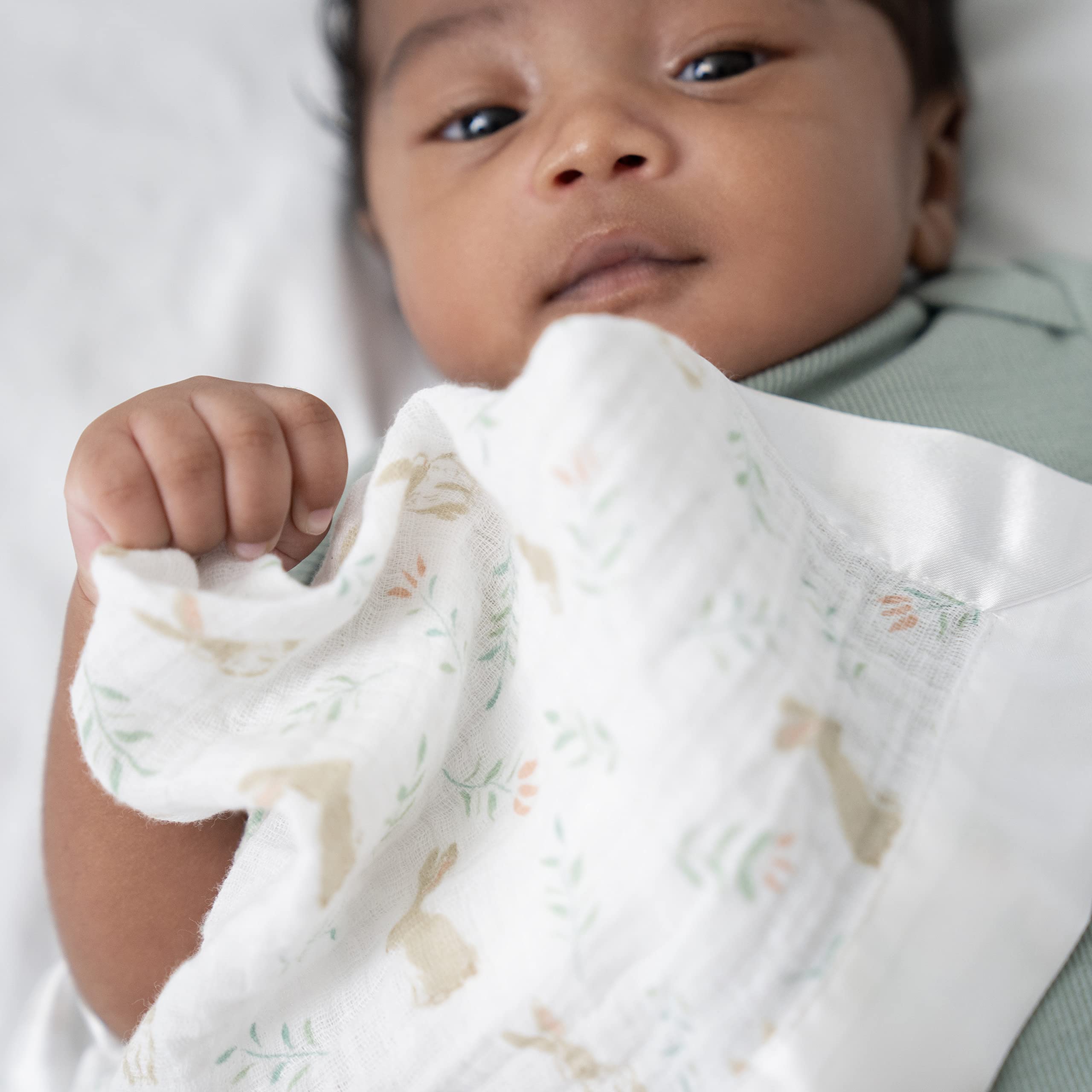 aden + anais Issie security blanket open weave air flow demonstrates breathable fabric for baby.