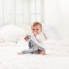 Issie security blanket satin trim closeup highlights silky texture for soothing touch.