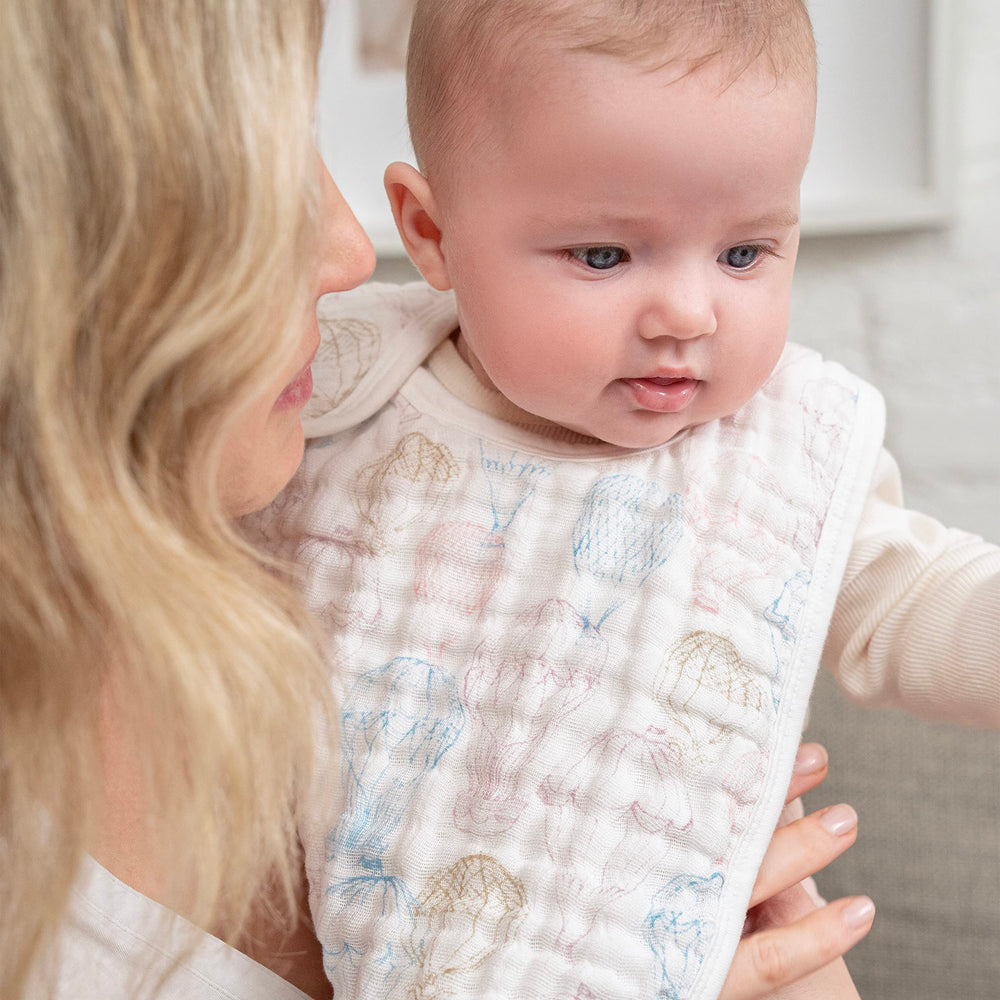 aden-anais snap bib 3-layer cotton closeup emphasizes soft, breathable muslin and strong absorbency.