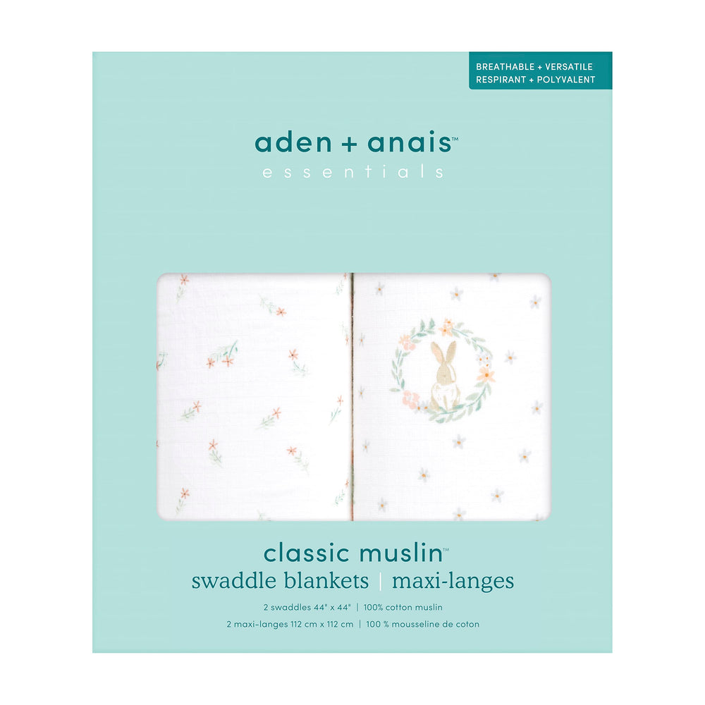 aden + anais Essentials Swaddle Blanket Blushing Bunnies as a stroller cover for shade.