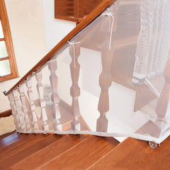 Adsoner child safety net being installed on a railing for secure balcony play.