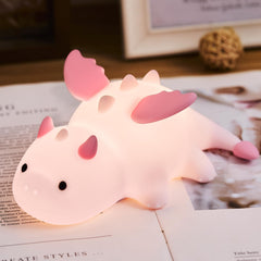 AGV Cici cute baby dragon night light pink on bedside improves bedtime ambiance