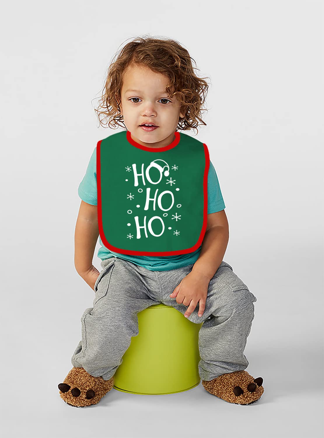 Aiden's Corner green baby holiday bib closeup highlighting soft fabric and skin-friendly feel