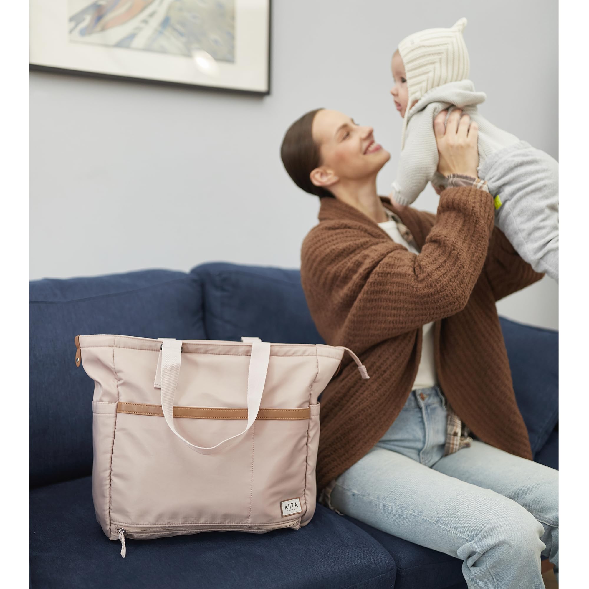 AIITA tote offers 12 pockets for organized storage of baby gear.