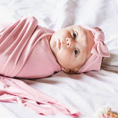 Aijoviko newborn swaddle blanket blush folded to show size