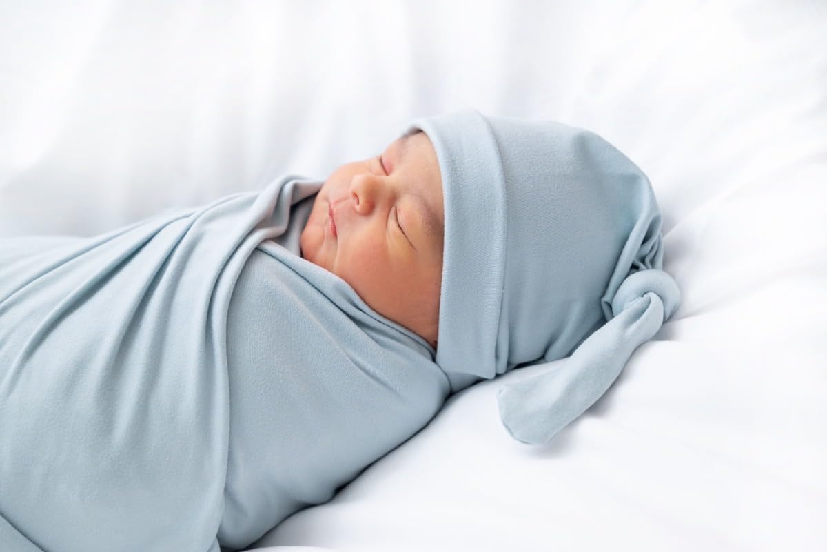 Aijoviko newborn swaddle blanket with hat set wrapped, showcasing soft fabric and cozy presentation.