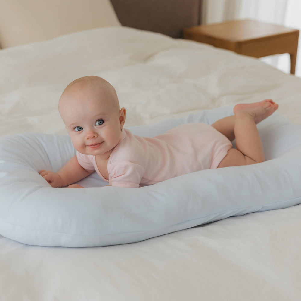 Aila + Aiden baby lounger breathable organic cotton fabric for gentle daytime lounging.