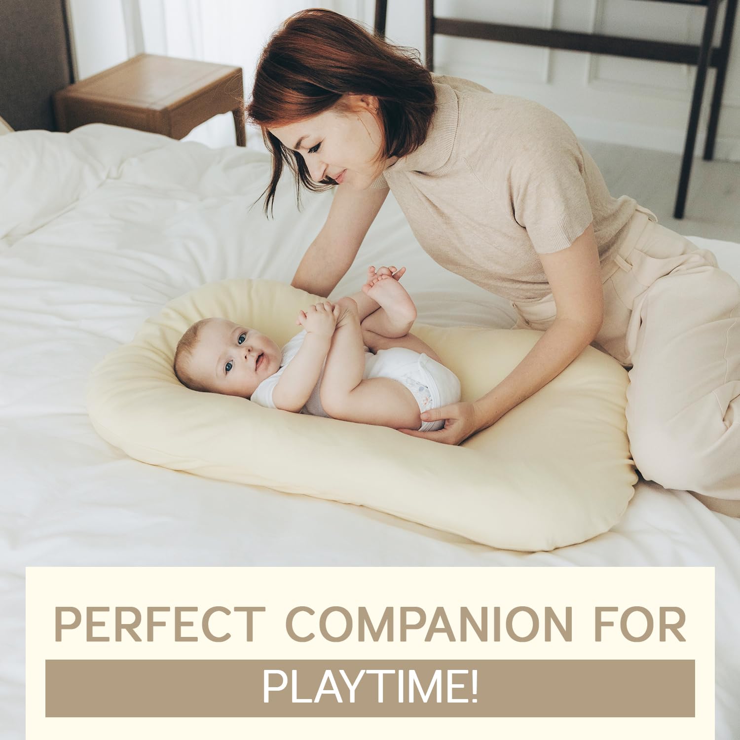 Aila + Aiden baby lounger cream carry handles shot emphasizes portable, travel-friendly use