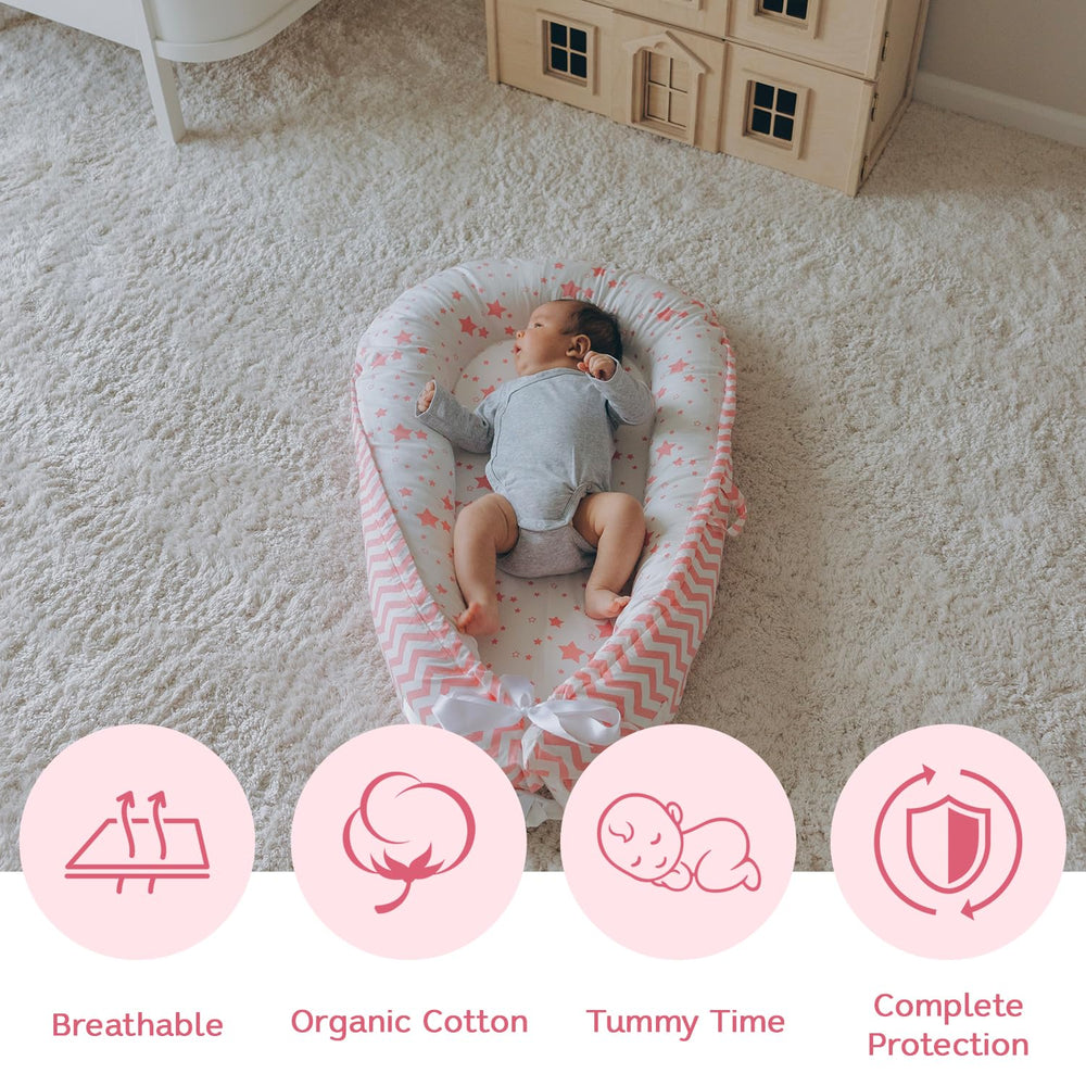 Aila+Aiden baby lounger pink reversible design offers two looks for everyday use.