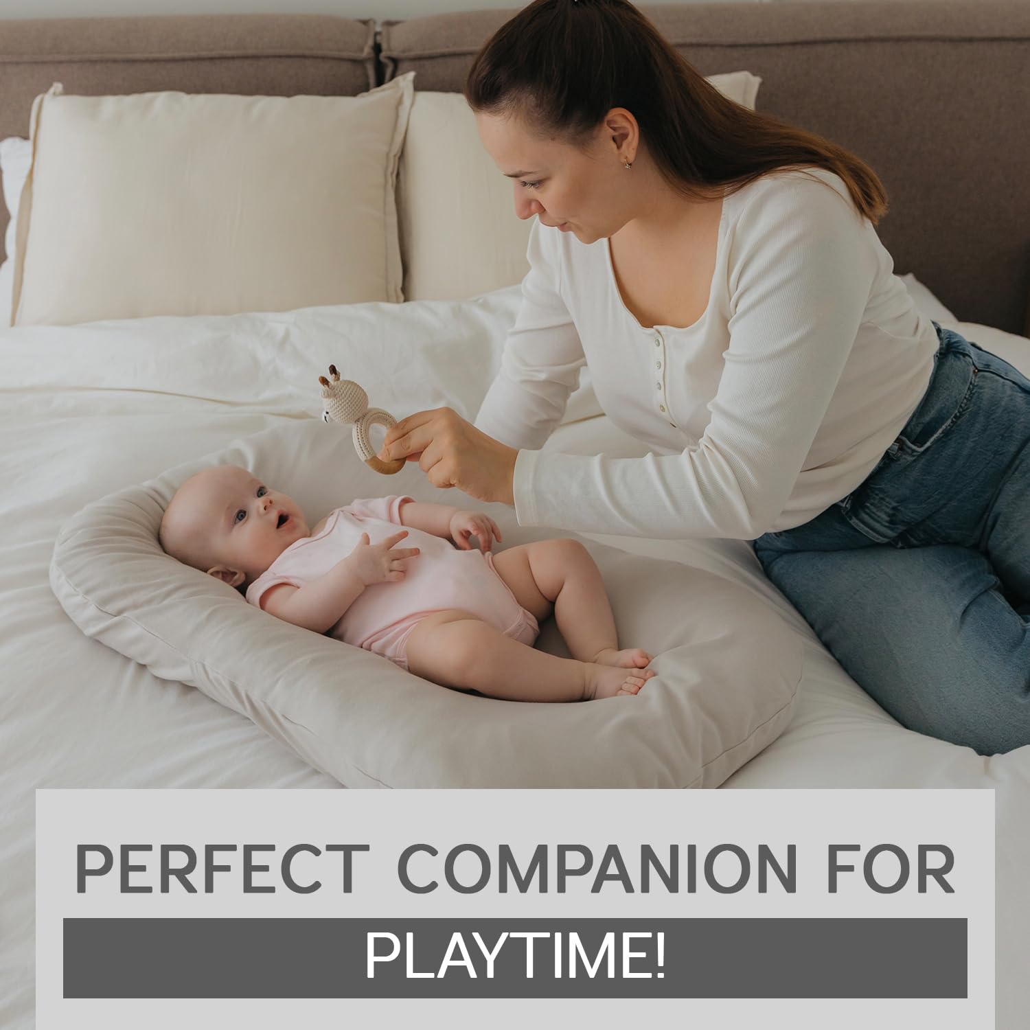 Aila + Aiden baby lounger portable with carry handles for travel-friendly use.