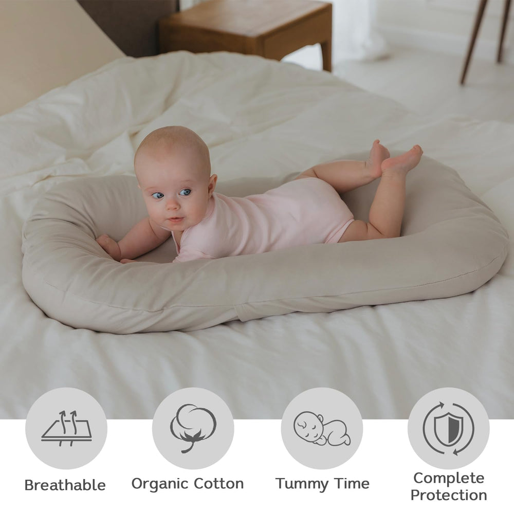 Aila + Aiden baby lounger close-up of soft organic cotton breathable fabric.
