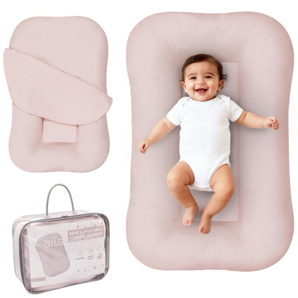 Aila + Aiden baby lounger soft pink cover provides gentle daytime comfort.