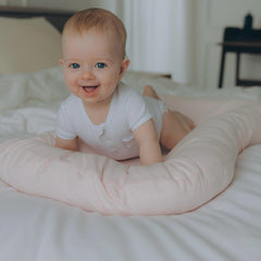 Aila + Aiden baby lounger pink compact with carry handles for travel.