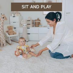 Aila+Aiden push cloth sun raddle adds visual and tactile stimulation at play.
