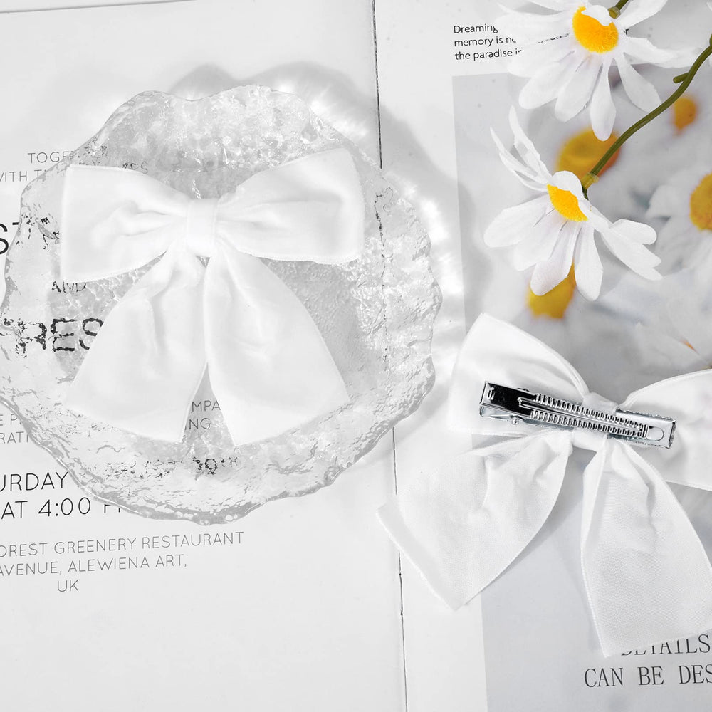 Aileam velvet bow clip attached to headband for versatile styling