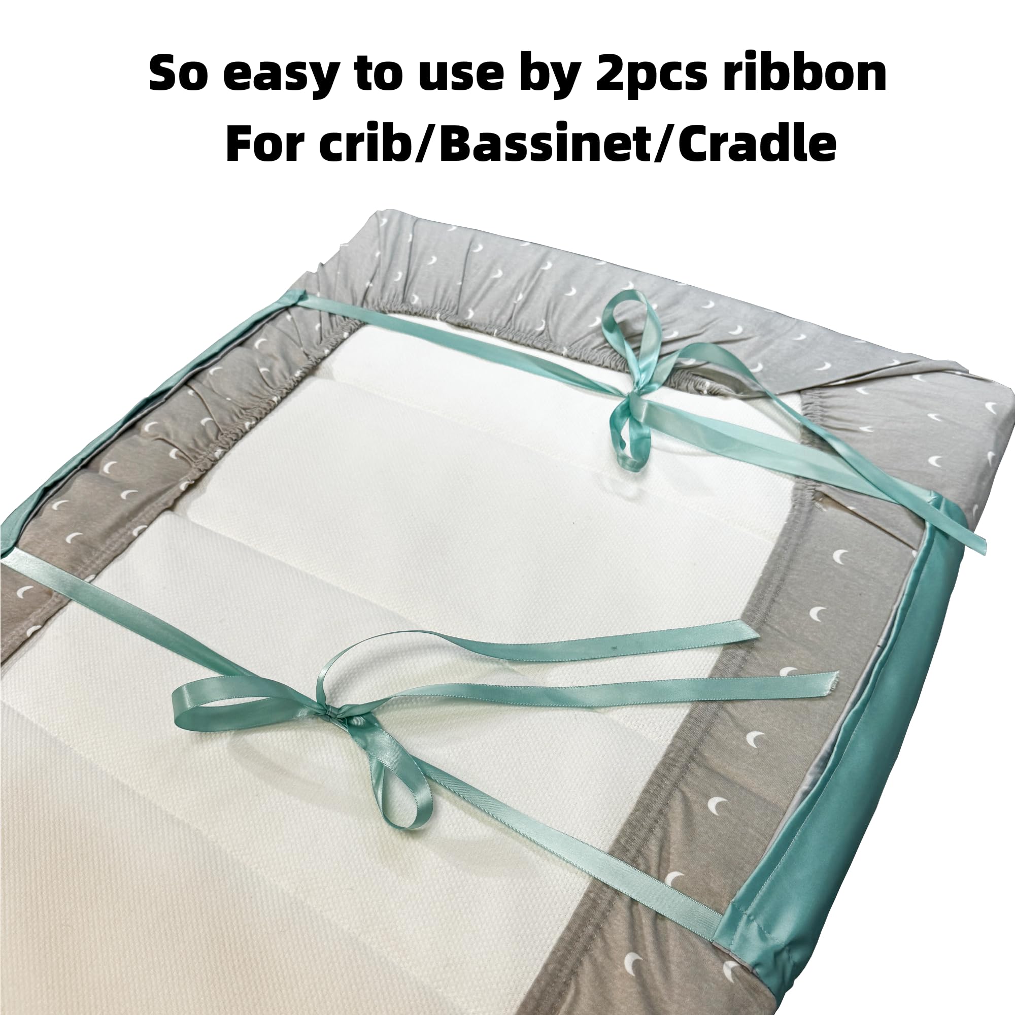 AKISS satin crib-sheet fitted view shows secure elastic fit for cribs or cradles.
