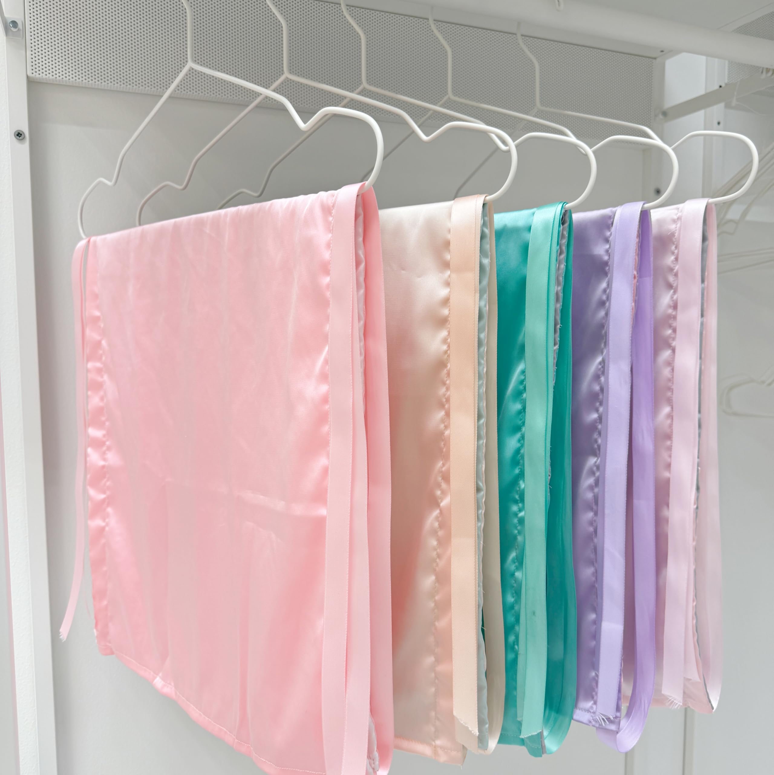 AKISS satin baby sheet Tiffany Blue highlights reversible colors for quick styling changes.
