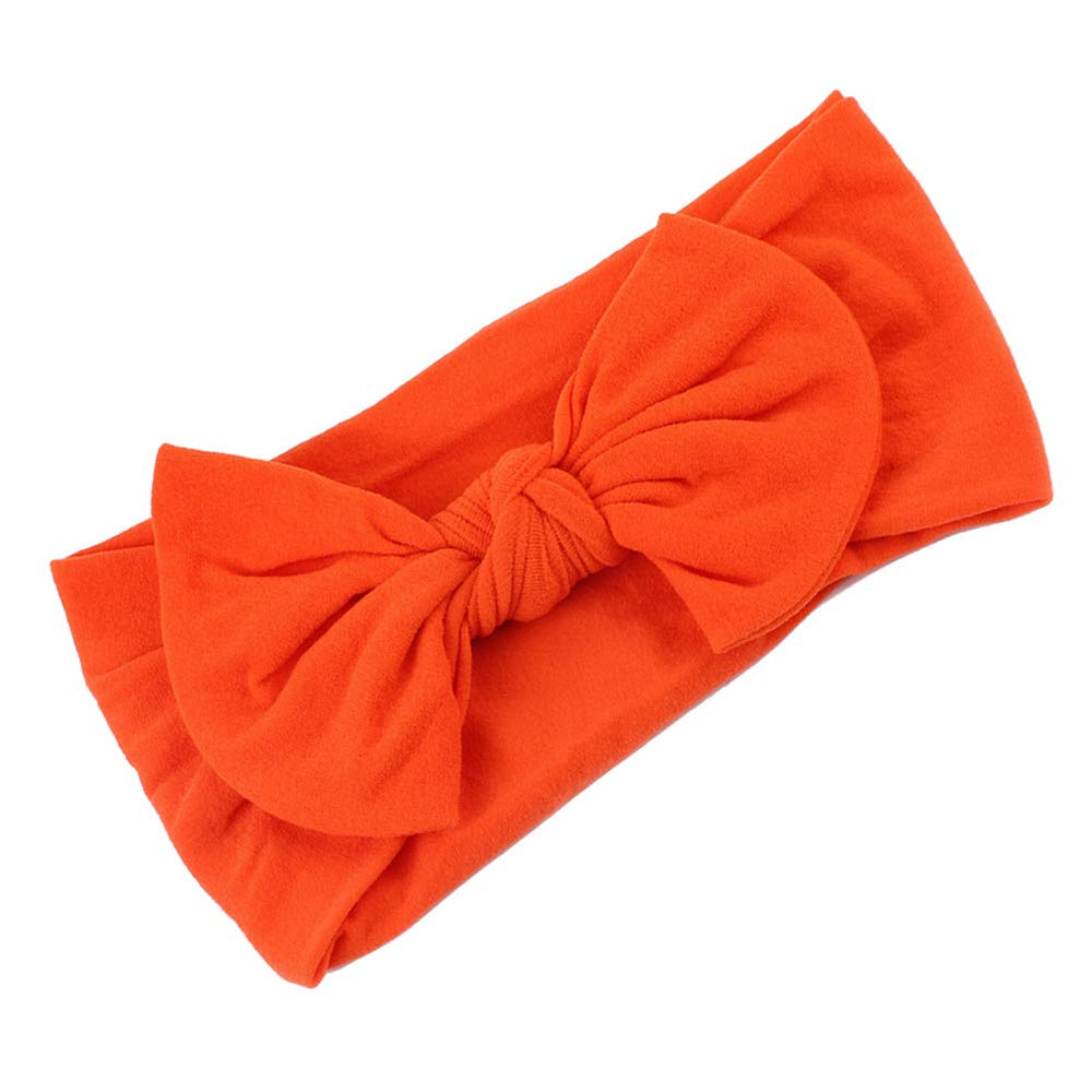 AKOAK orange headband close-up, elastic softness for comfy all-day use.