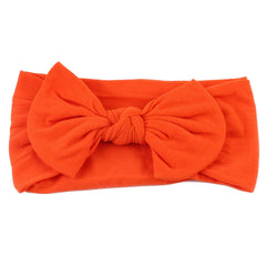 AKOAK orange baby headband, front view, skin-friendly nylon for daily wear.