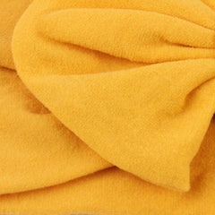 AKOAK yellow headband elastic-detail shows gentle stretch and secure placement.